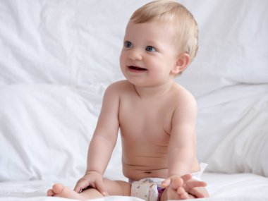 Cute caucasian baby girl in bed