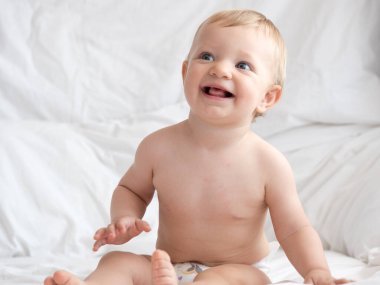 Cute caucasian baby girl in bed