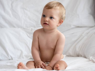 Cute caucasian baby girl in bed