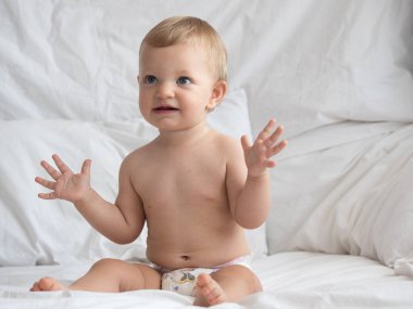 Cute caucasian baby girl in bed