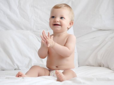 Cute caucasian baby girl in bed