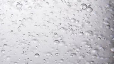 Hareket eden gri baloncuklu soyut arkaplan 