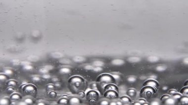 Hareket eden gri baloncuklu soyut arkaplan 