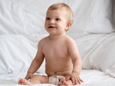 Cute caucasian baby girl in bed