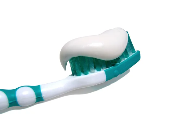 Toothbrush with paste on a white background, macro. — Stock Photo, Image