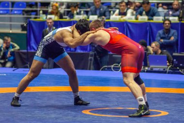 Match between Kyle Snyder, Titan Mercury Wrestling Team USA vs Abbas Tahan, Wrestling Team Razi Iran during World Wrestling Club Cup, December 1, 2016, Kharkov, Ukraine