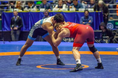 Match between Kyle Snyder, Titan Mercury Wrestling Team USA vs Abbas Tahan, Wrestling Team Razi Iran during World Wrestling Club Cup, December 1, 2016, Kharkov, Ukraine