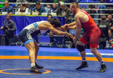 Match between Kyle Snyder, Titan Mercury Wrestling Team USA vs Abbas Tahan, Wrestling Team Razi Iran during World Wrestling Club Cup, December 1, 2016, Kharkov, Ukraine