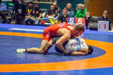 Match between David Taylor, Titan Mercury Wrestling Team USA vs Alireza Karimimachiani, Wrestling Team Razi Iran during World Wrestling Club Cup, December 1, 2016, Kharkov, Ukraine