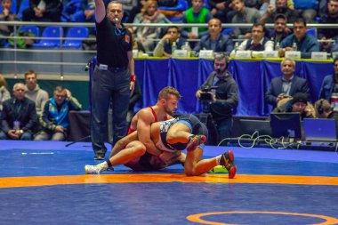 Match between David Taylor, Titan Mercury Wrestling Team USA vs Alireza Karimimachiani, Wrestling Team Razi Iran during World Wrestling Club Cup, December 1, 2016, Kharkov, Ukraine