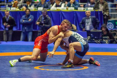 Match between David Taylor, Titan Mercury Wrestling Team USA vs Alireza Karimimachiani, Wrestling Team Razi Iran during World Wrestling Club Cup, December 1, 2016, Kharkov, Ukraine