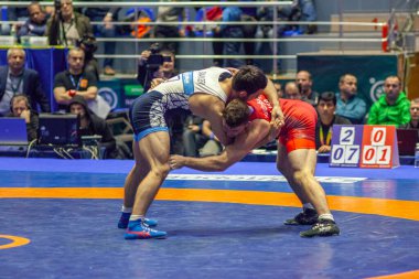 Match between Nazar Kulchytskyy, Titan Mercury Wrestling Team USA vs Atsamaz Sanakoev, Wrestling Team Razi Iran during World Wrestling Club Cup, December 1, 2016, Kharkov, Ukraine