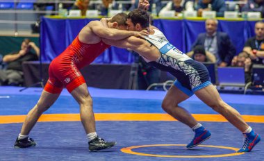 Match between Nazar Kulchytskyy, Titan Mercury Wrestling Team USA vs Atsamaz Sanakoev, Wrestling Team Razi Iran during World Wrestling Club Cup, December 1, 2016, Kharkov, Ukraine