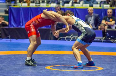 Match between Nazar Kulchytskyy, Titan Mercury Wrestling Team USA vs Atsamaz Sanakoev, Wrestling Team Razi Iran during World Wrestling Club Cup, December 1, 2016, Kharkov, Ukraine