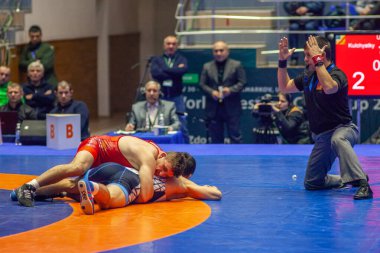 Match between Nazar Kulchytskyy, Titan Mercury Wrestling Team USA vs Atsamaz Sanakoev, Wrestling Team Razi Iran during World Wrestling Club Cup, December 1, 2016, Kharkov, Ukraine