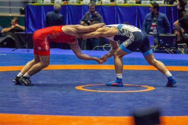 Match between Nazar Kulchytskyy, Titan Mercury Wrestling Team USA vs Atsamaz Sanakoev, Wrestling Team Razi Iran during World Wrestling Club Cup, December 1, 2016, Kharkov, Ukraine