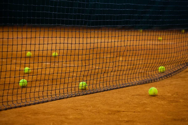 Tennis balls on the tennis court. Tennis game. Sport, recreation concept