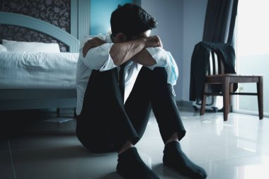 Handsome young depressed businessman