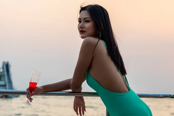 Asian Young Woman Drink Swimsuit Posing Yacht Sunset — Stockfoto