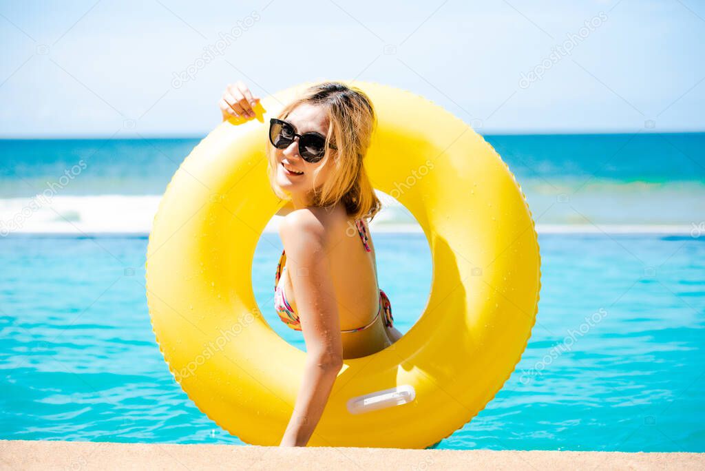 Asian sexy woman with inflatable ring