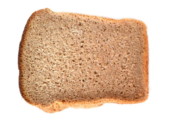 Бурый хлеб на белом . — стоковое фото