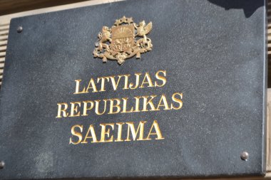 Nameplate with the inscription: Latvian Saeima Republican. clipart