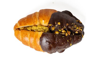 The High-resolution photograph of a chocolate croissant isolate on white, taken with a high-resolution 45MP camera