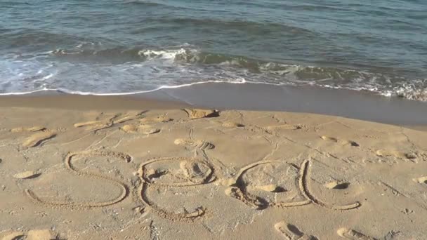 Ordet "hav" på sand – stockvideo