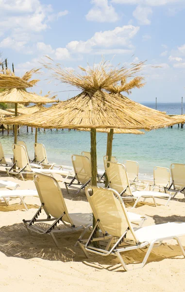 Beach umbrellas on sea — Stock Photo, Image