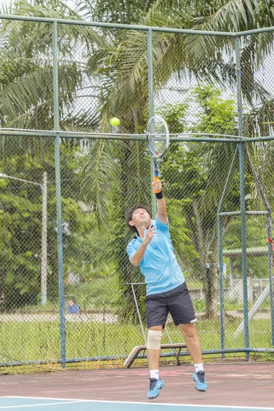 Tennis player in action — Stock Photo, Image