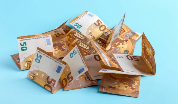 Fifty Euro Bills Scattered Light Blue Background — Stock Photo, Image