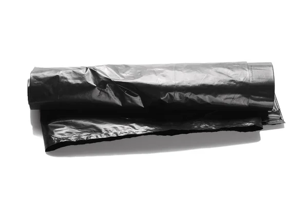 Bolsa de basura negra de plástico aislada sobre fondo blanco —  Fotos de Stock