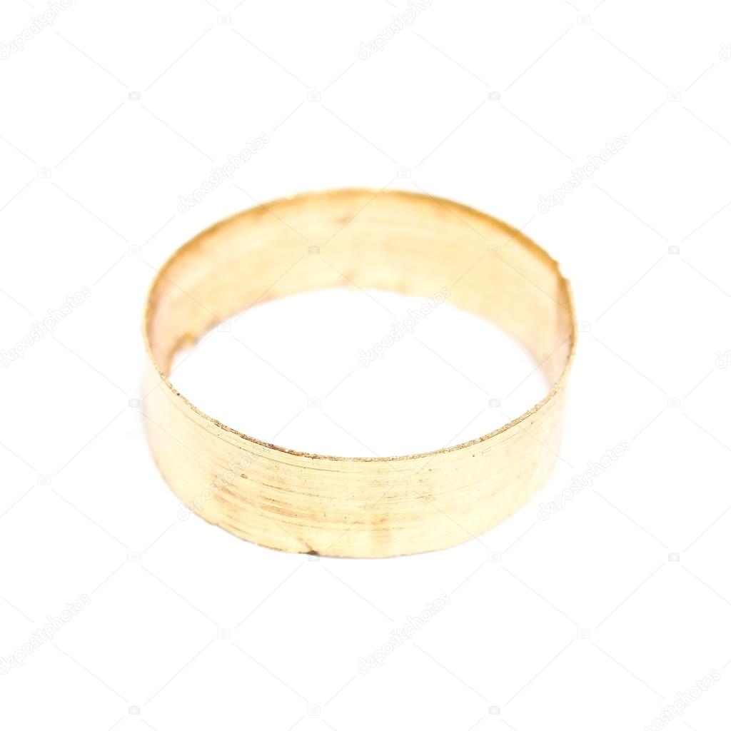 macro of metal golden ring shaving isolated on white