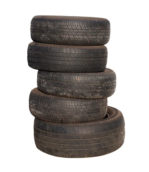 Neumáticos viejos apilados, aislados sobre fondo blanco — Foto de Stock