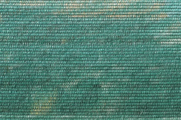 Abstrakcyjna faktura siatki z tworzywa sztucznego na zielone tło — Zdjęcie stockowe