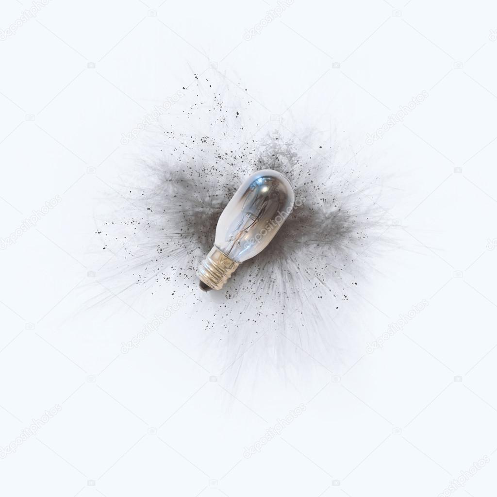 A single burned out light bulb on a bright white background
