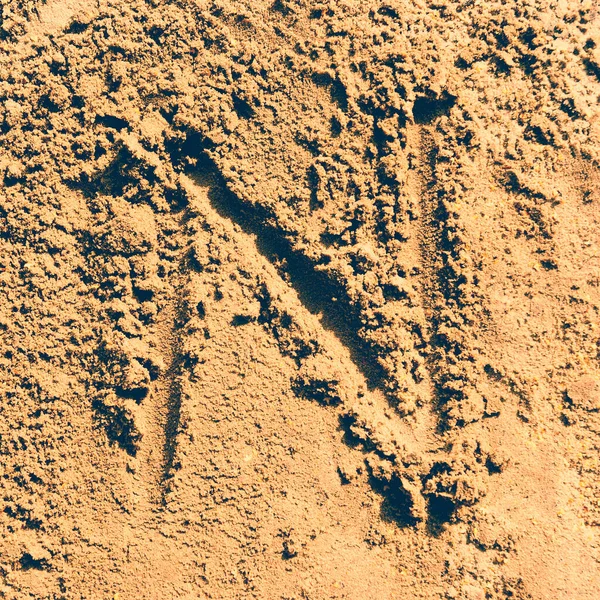 用沙子拼成的字母 — 图库照片