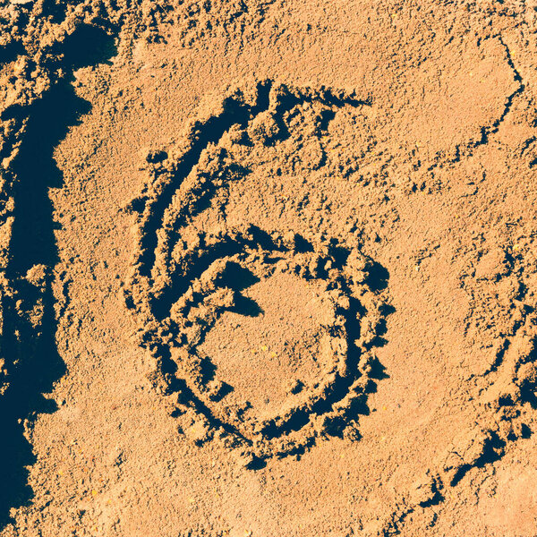 number ''6'' made from a sand