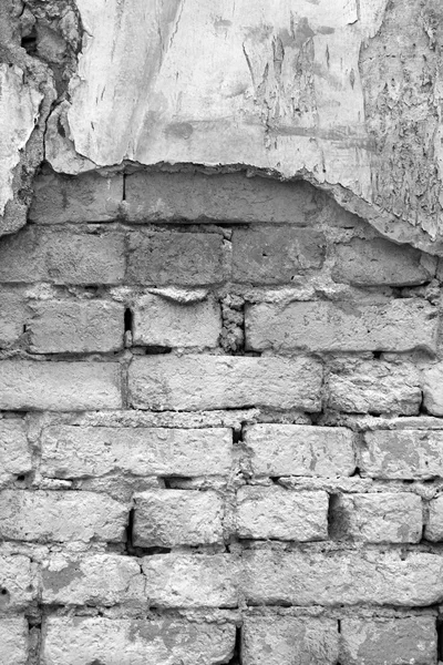 Concreto rachado com parede de tijolo — Fotografia de Stock
