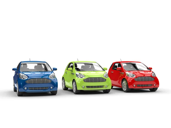 Малі автомобілі поспіль - червоний, зелений і синій — стокове фото