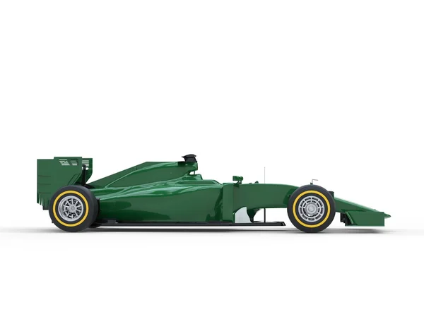 Donker groene Formule 1 auto - zijaanzicht — Stockfoto