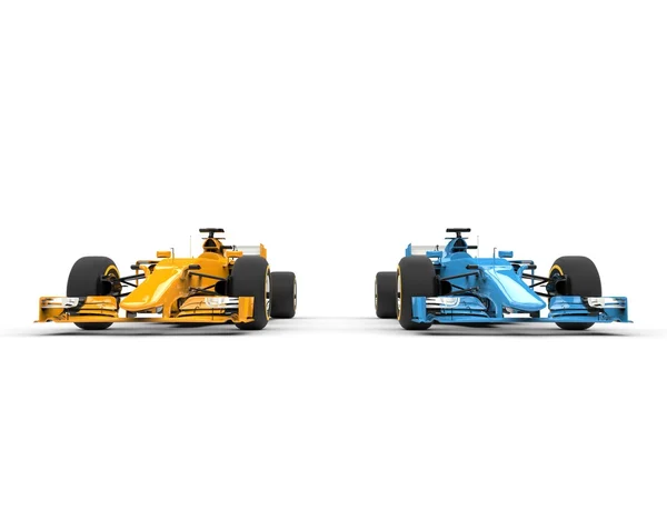 Yellow and blue formula one cars - side by side — Stock Photo, Image