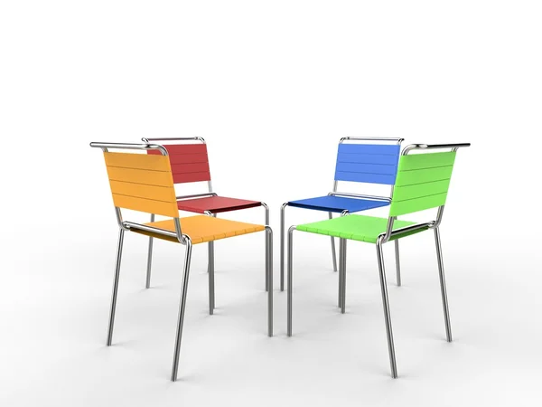 Four colorful chairs facing each other - on white background — Stock Photo, Image