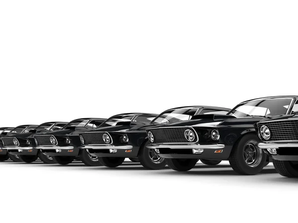 Fila de coches negros clásicos del músculo —  Fotos de Stock