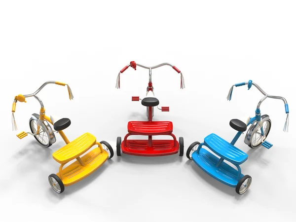 Triciclos rojos, azules y amarillos - vista superior —  Fotos de Stock