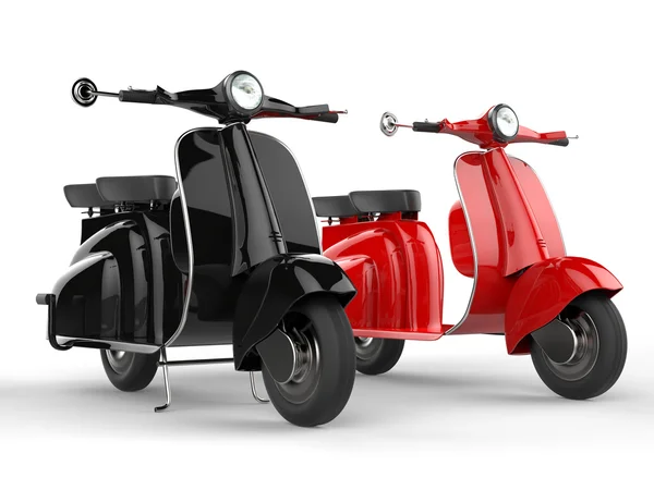 Черный и красный скутеры - бок о бок — стоковое фото