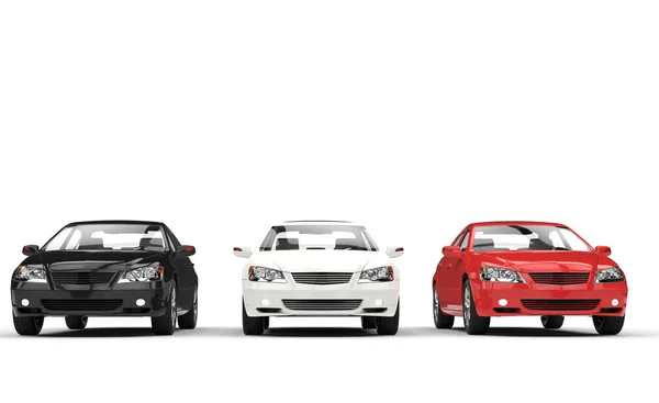 Black, white, and red cars in a showroom — Stock Photo, Image