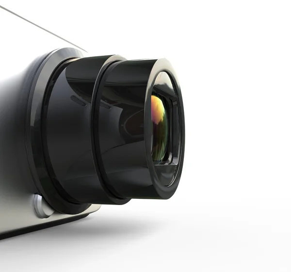 Pequeña cámara plateada sobre fondo blanco - primer plano de la lente — Foto de Stock