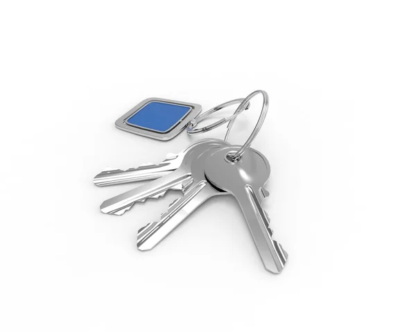 Keys on a keyring with blue pendant on white background — Stock Photo, Image