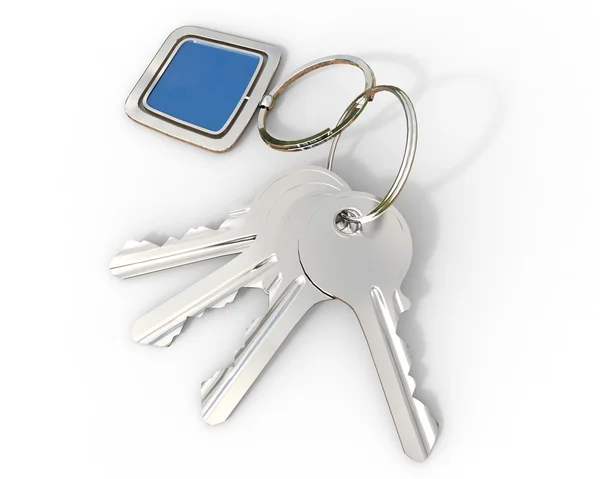 Klíče s modrými přívěsek na bílém pozadí — Stock fotografie